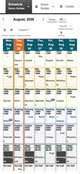 The MetricAid schedule on a narrow mobile browser screen, with the view selector set to Month. A week of columns from Monday to Sunday runs across the top with the current day highlighted, and each column lists the day's shifts by name and time — Day, Mid, Afternoon, Evening, Casino, Night, and On Call — with the assigned provider in each cell.